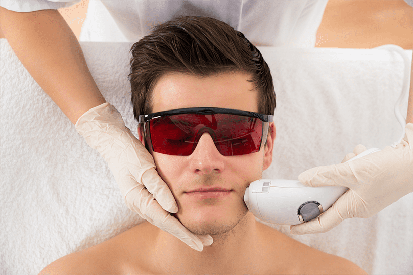 Male patient receiving laser hair removal