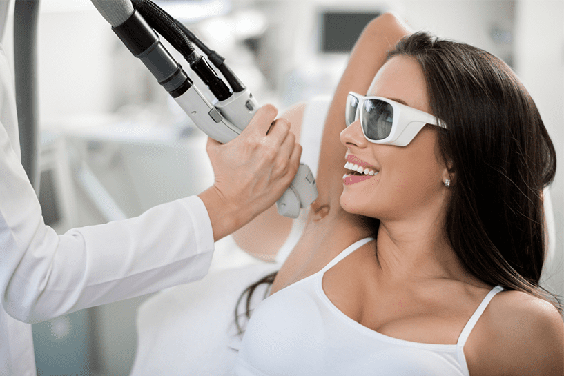Patient receiving underarm laser hair removal